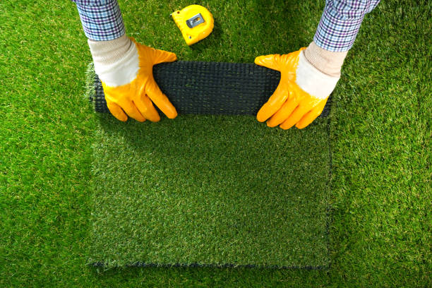 Man Holding Turf